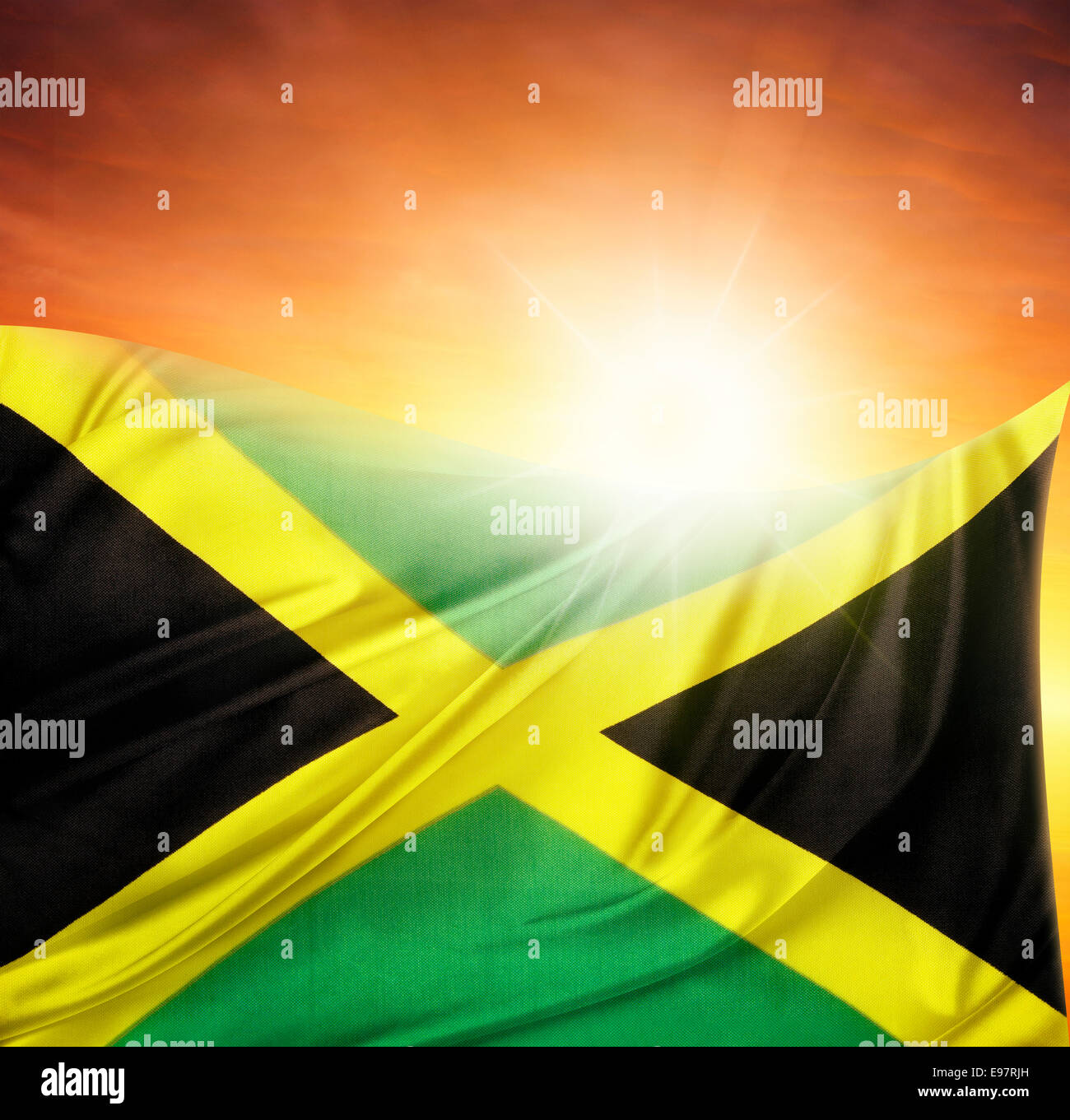 Jamaican flag in front of bright sky Stock Photo