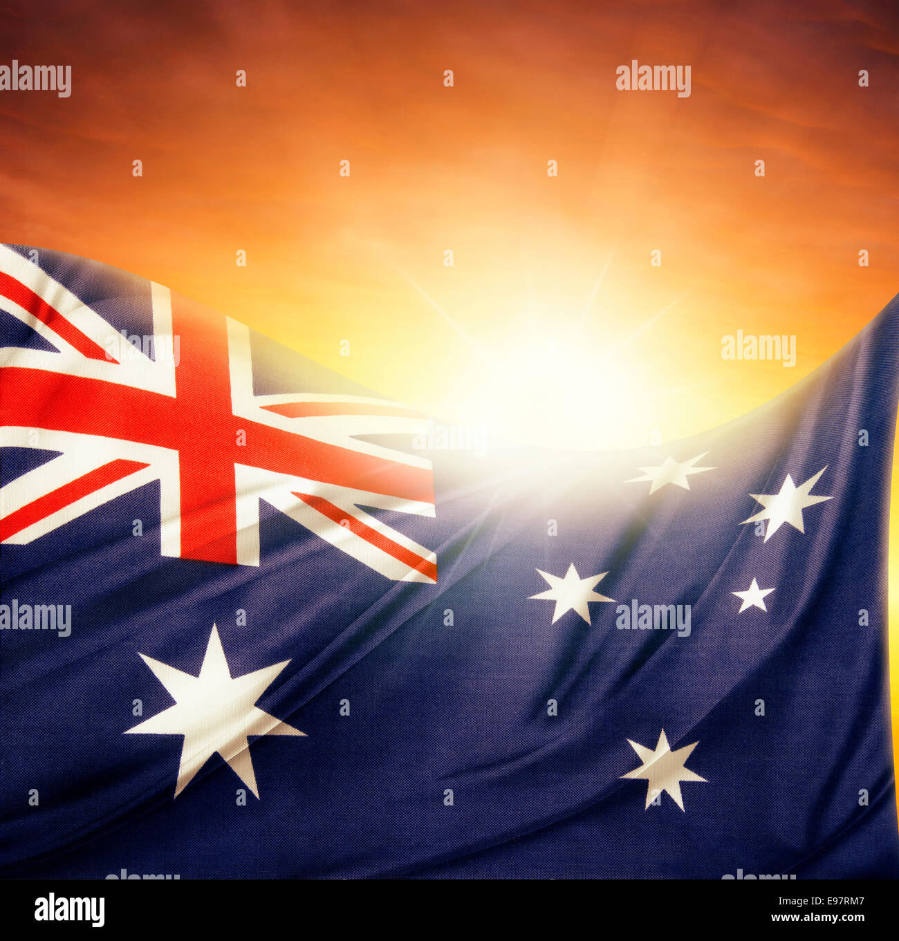 Australian flag in front of bright sky Stock Photo