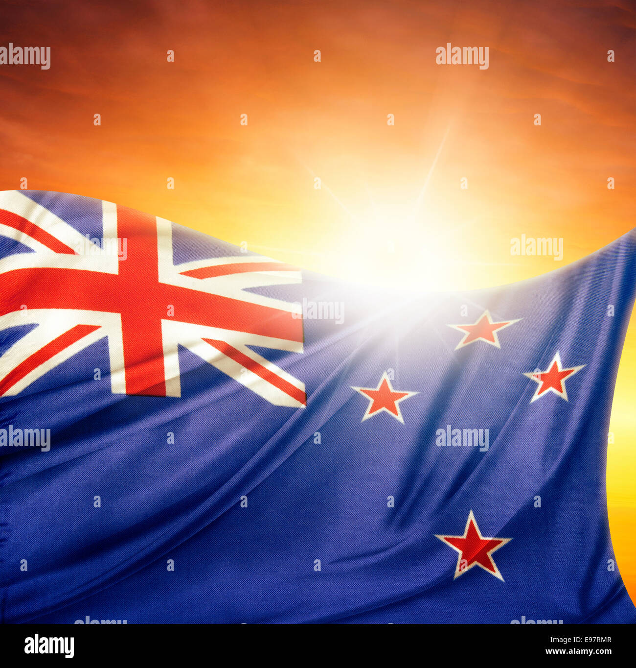 New Zealand flag in front of bright sky Stock Photo