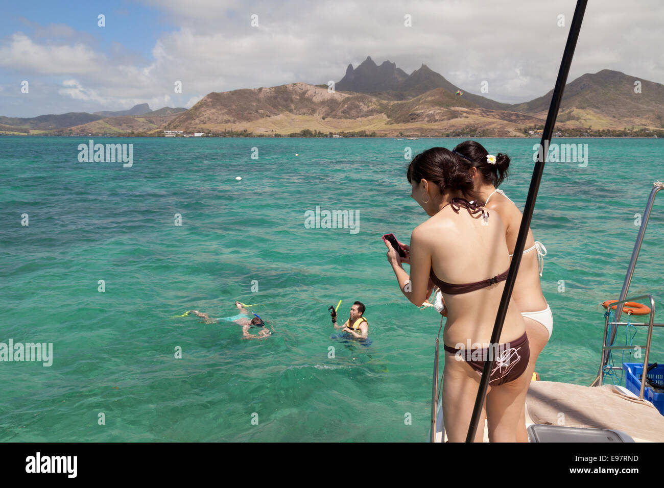 Mauritius travel; Tourists snorkelling in Mauritius, Indian ocean, Africa Stock Photo