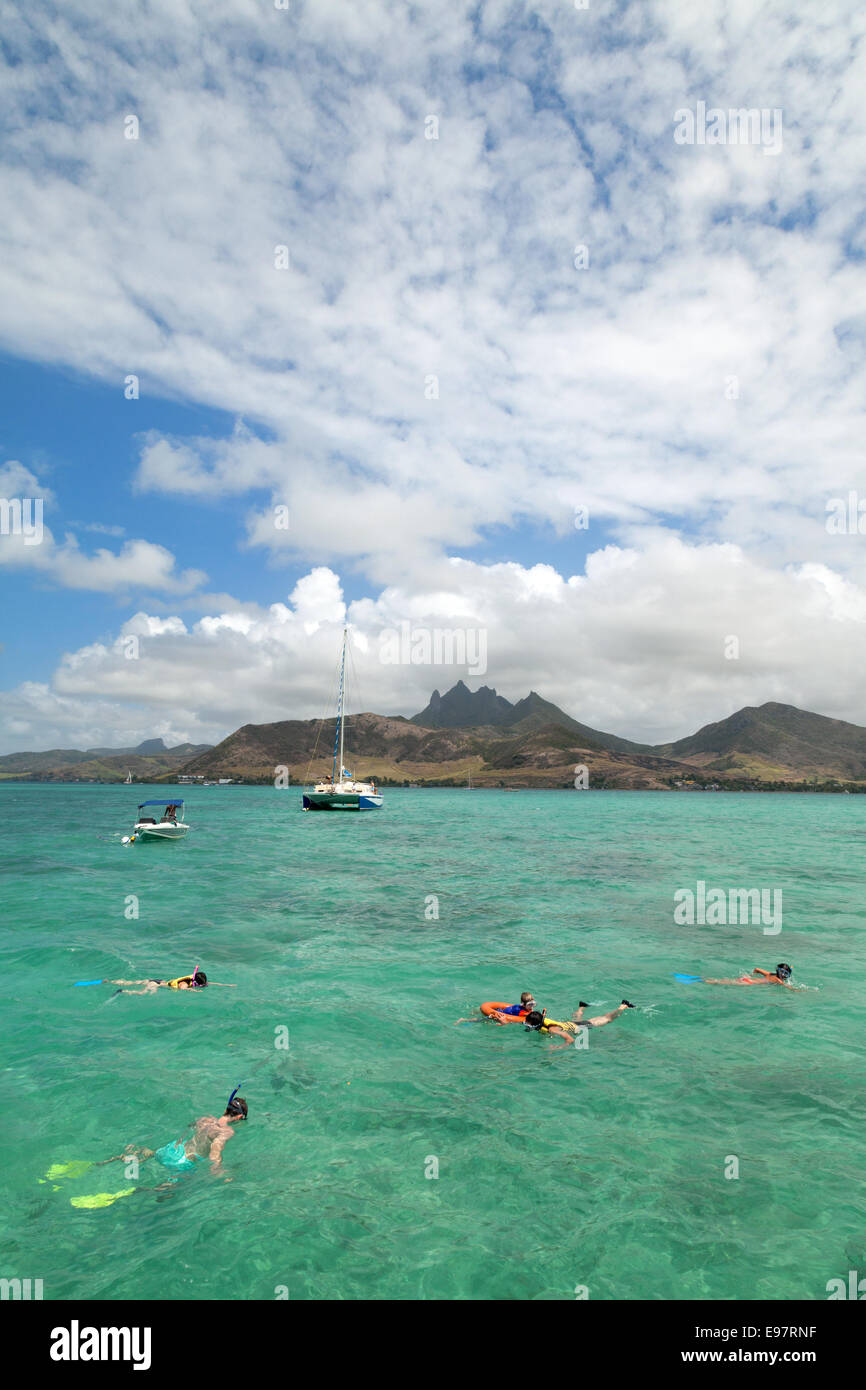 Mauritius tourism; Tourists snorkelling in Mauritius, Africa Stock Photo