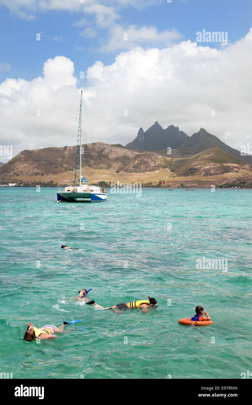 Mauritius tourists; People snorkelling in the Indian Ocean, Mauritius Stock Photo