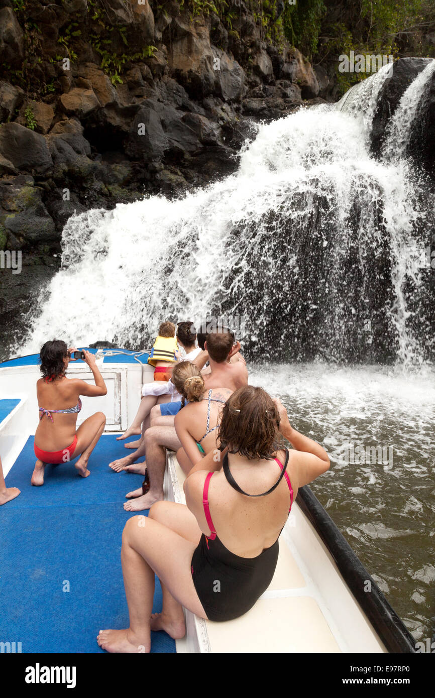 tourists looking at the waterfall at Beau Champ, on the Grande Riviere