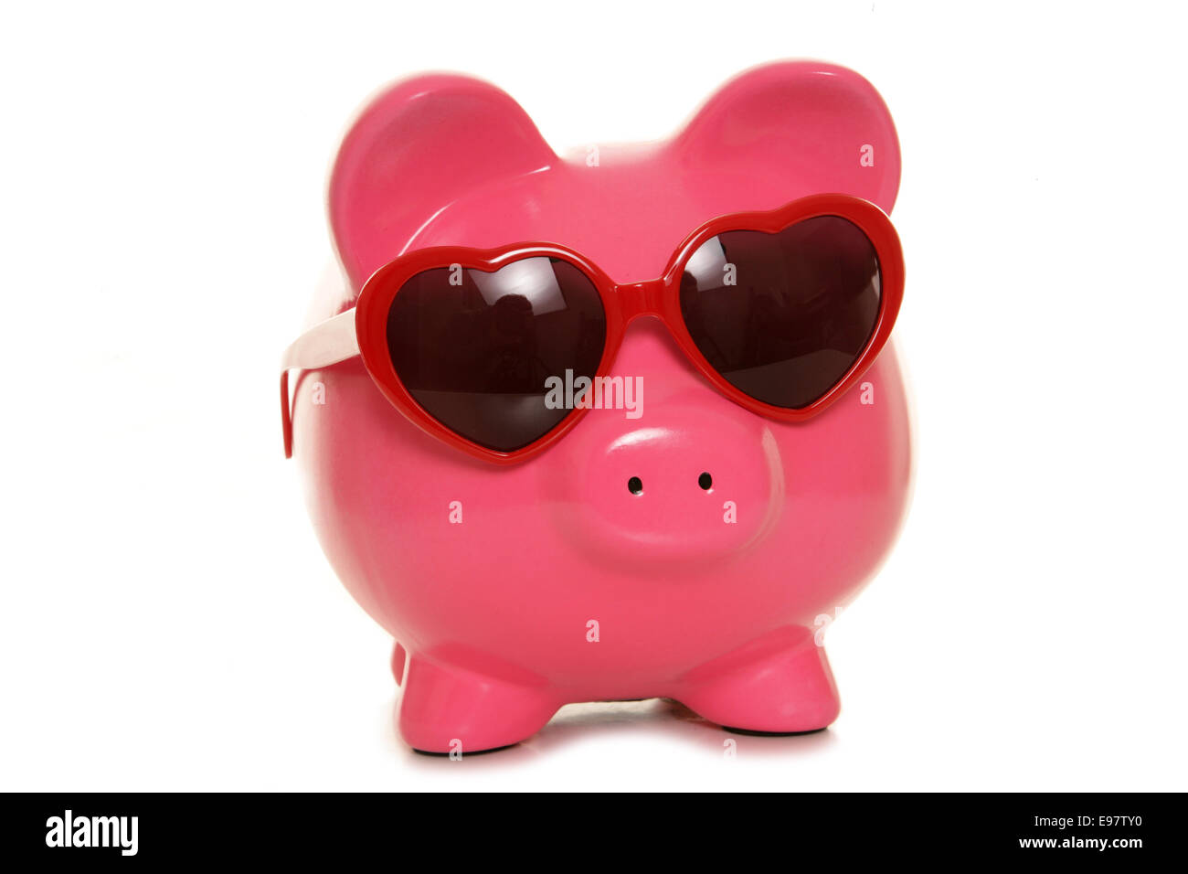 piggy bank wearing heart shape glasses cutout Stock Photo