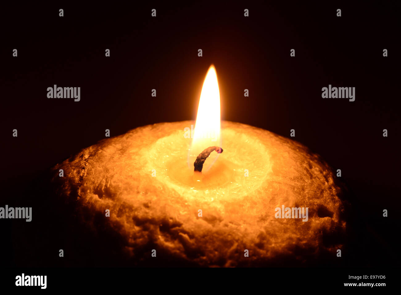 Burning candle on a black background Stock Photo Alamy