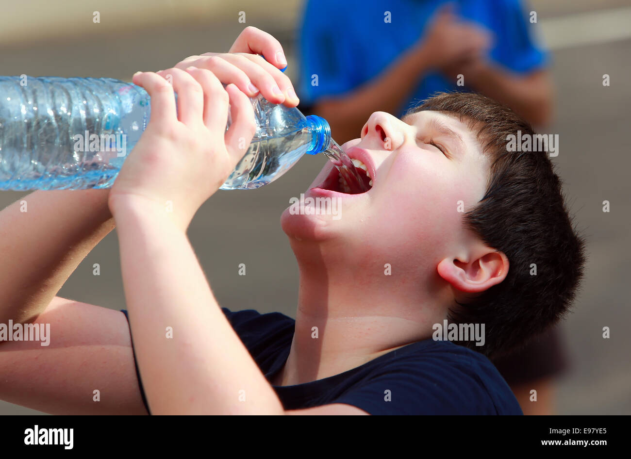 https://c8.alamy.com/comp/E97YE5/a-boy-thirsty-eagerly-drinking-water-from-plastic-bottle-E97YE5.jpg