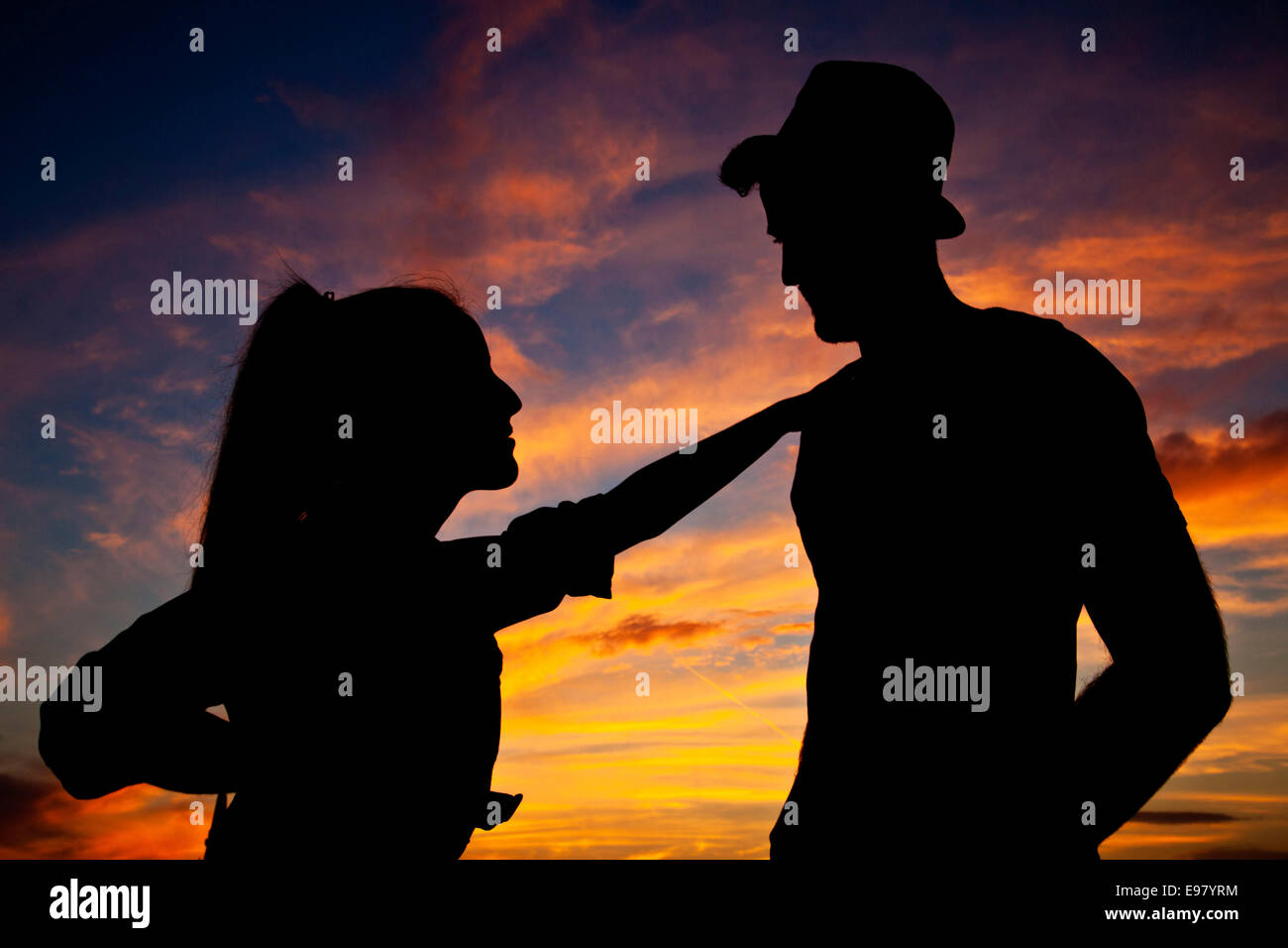 Young couple dancing at sunset Stock Photo
