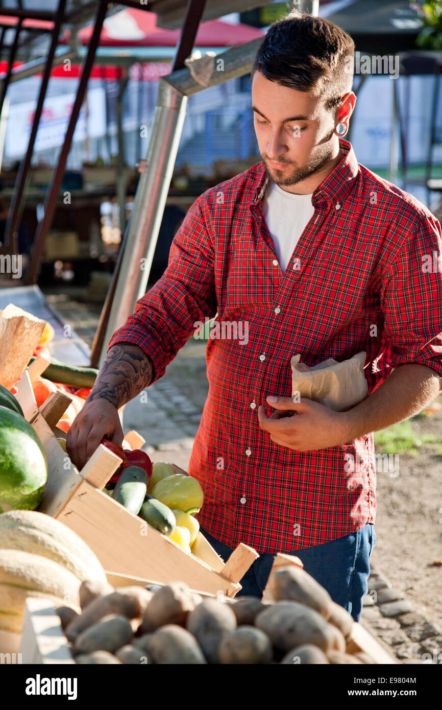 Man buying vegetables hi-res stock photography and images - Alamy