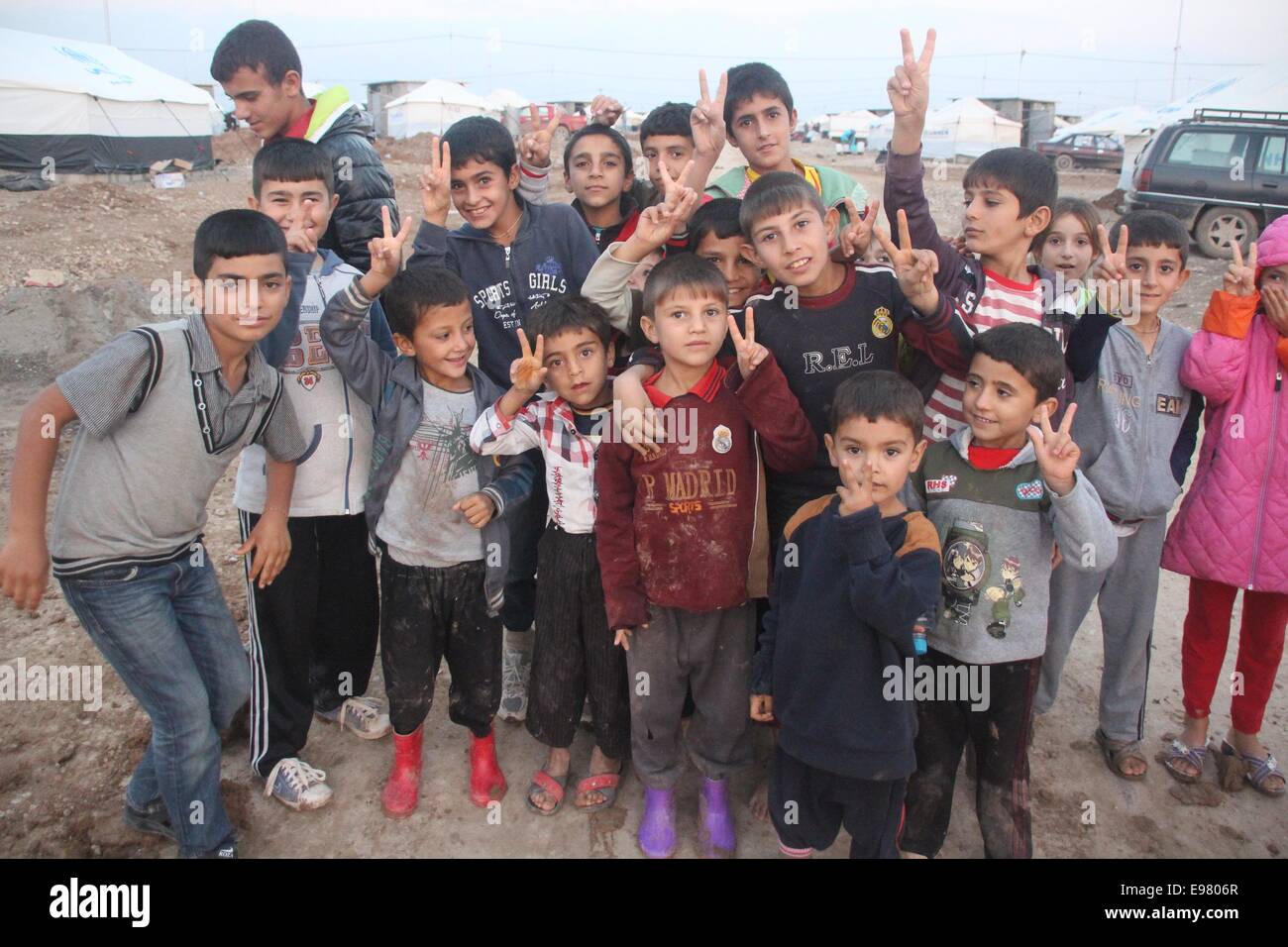 Dohuk, Iraq. 21st Oct, 2014. Yazidi children pose for a photo in the Khanki camp, about 20 km northwest of the province of Dohuk, northern Iraq, Oct. 21, 2014. © Yaser Jawad/Xinhua/Alamy Live News Stock Photo