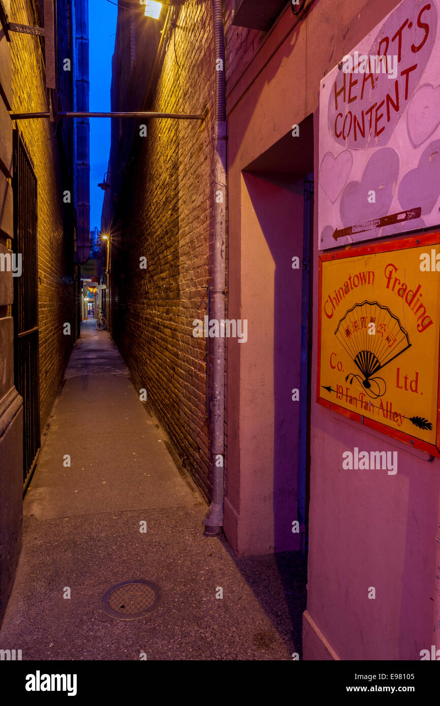 Fan Tan alley world's narrowest street in Chinatown at night-Victoria, British Columbia, Canada. Stock Photo