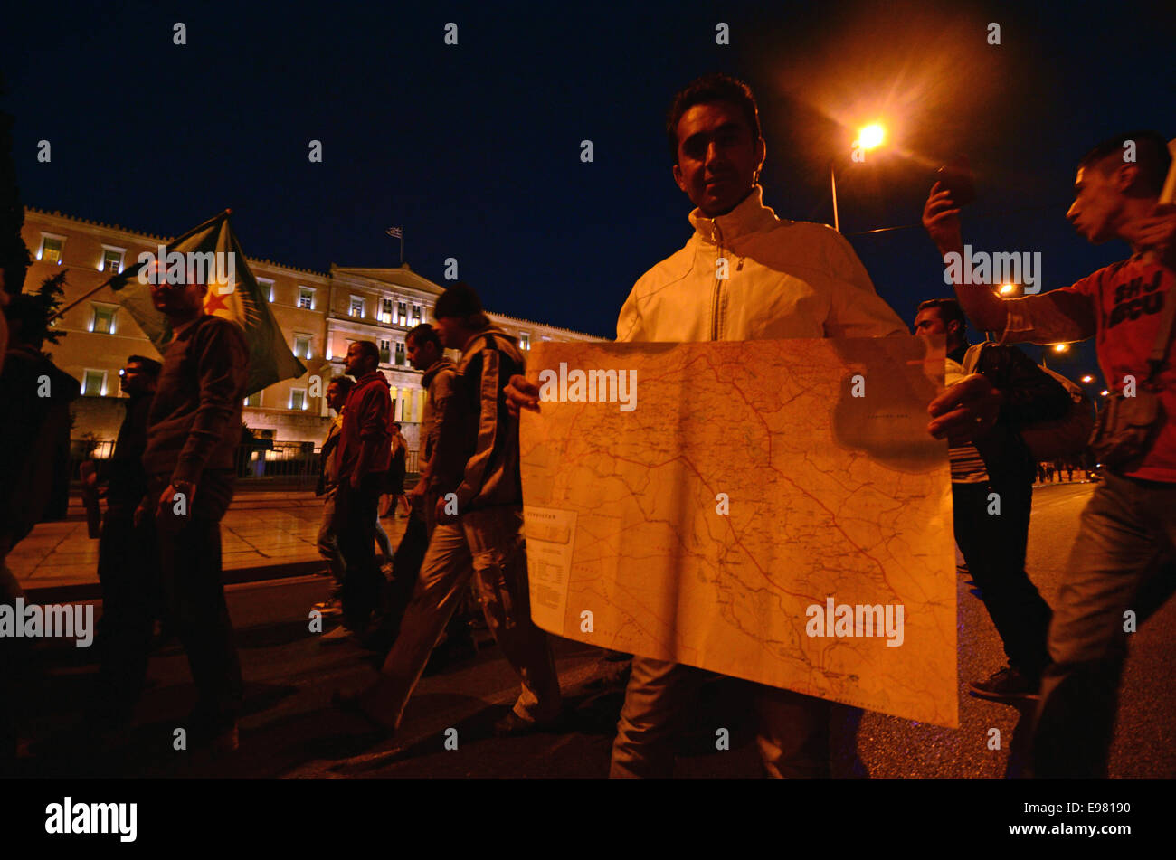 Athens, Greece. 21st Oct, 2014. A demonstrator olds a map of Kurdistan while marching in front of the Greek Parliament.Kurdish people that live in Athens organised a demonstration in support of the Kurdish people in Kobane city of North Iraq against the ISIS insurgents. Credit:  George Panagakis/Pacific Press/Alamy Live News Stock Photo