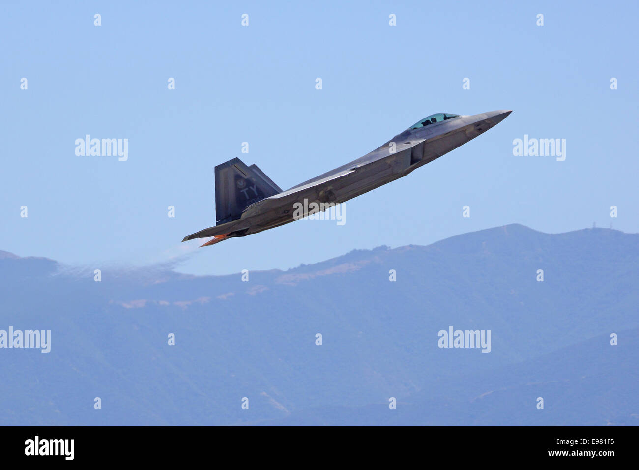 Modern F-22 Raptor US Fighter Aircraft flying at 2014 Planes of Fame Air show in Chino, California Stock Photo