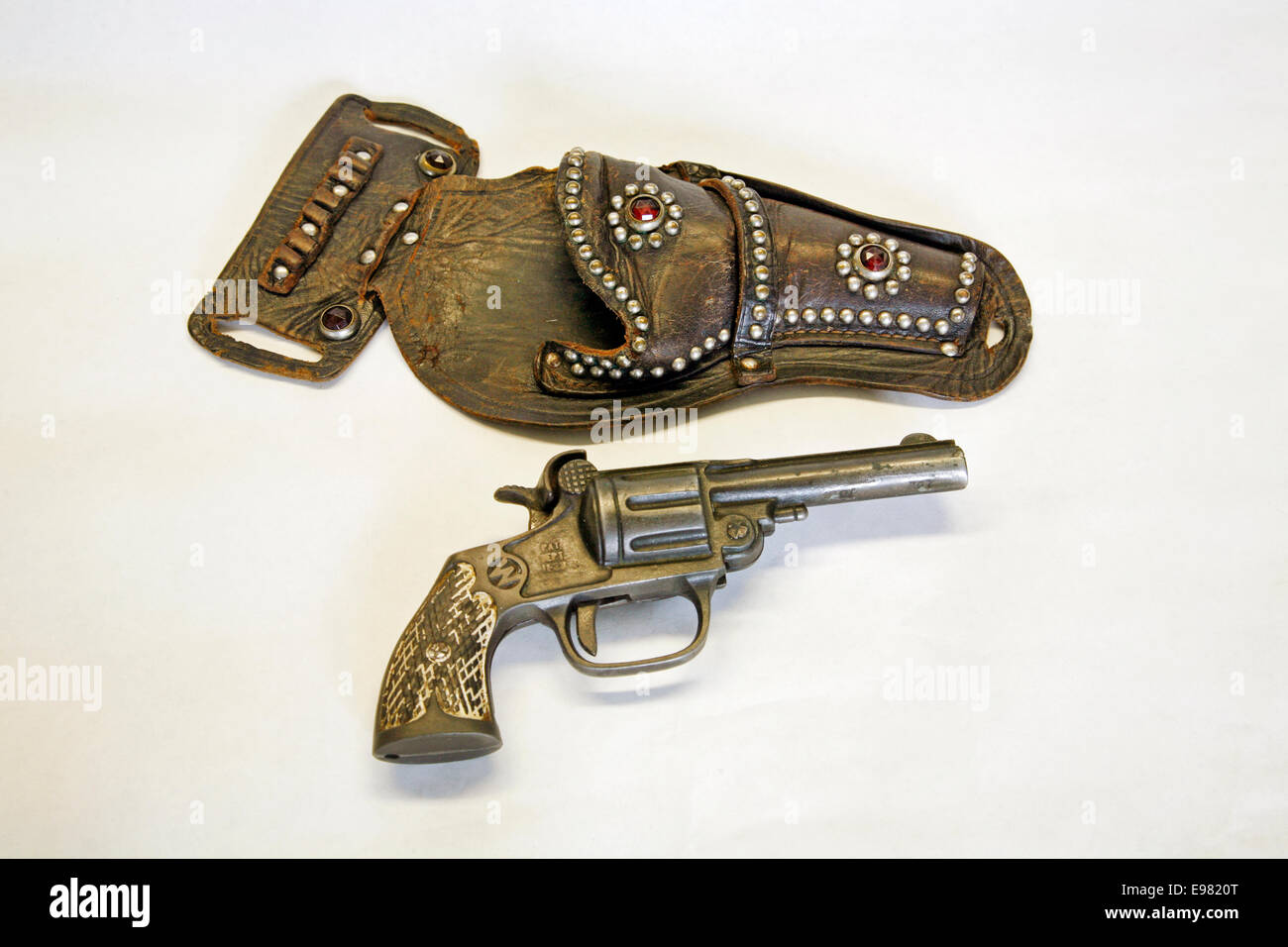 An antique cap pistol and leather holster circa 1900 Stock Photo