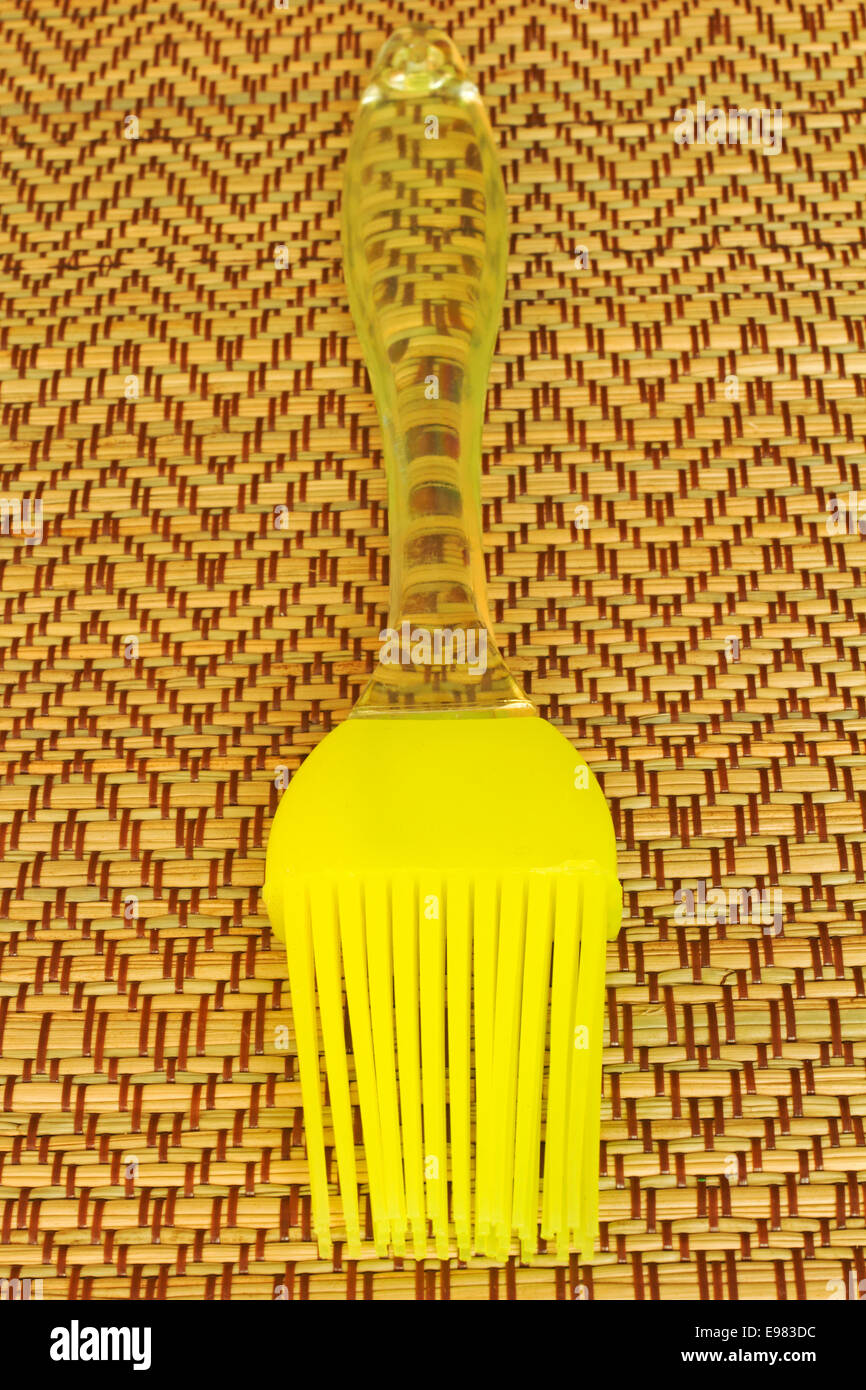 Brush grease on a straw background with a blurred background Stock