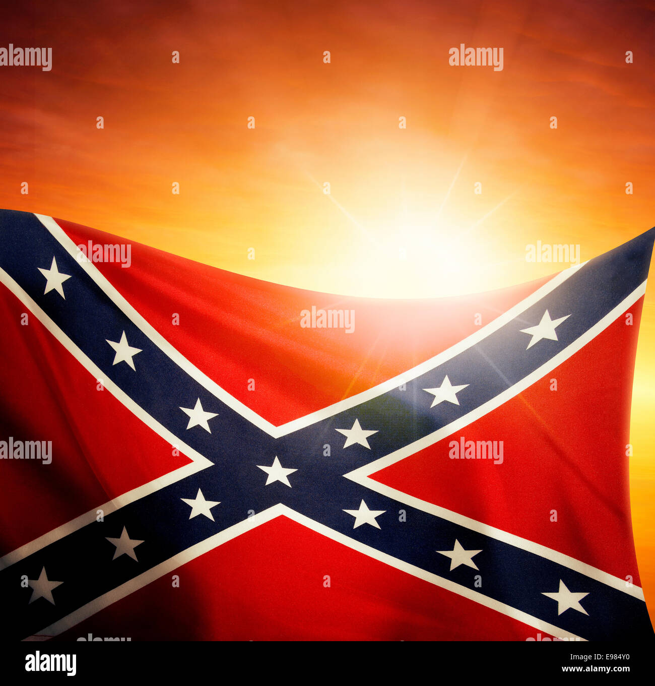 Confederate flag in front of bright sky Stock Photo