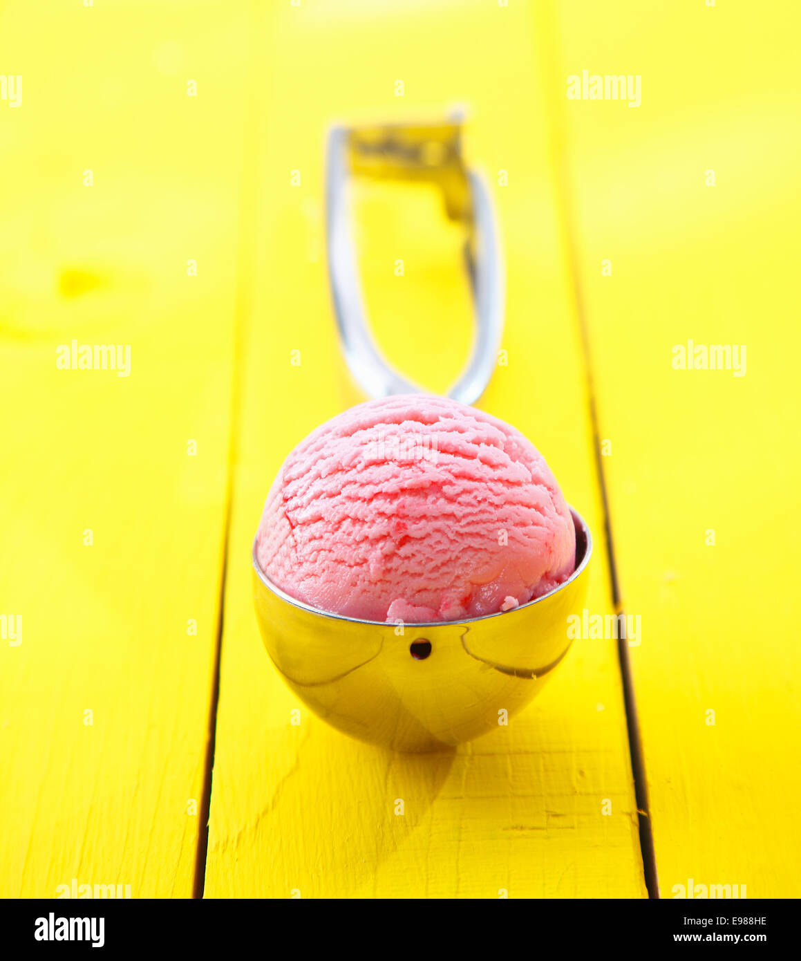 Close up shot of ice cream scoop with ice cream in it - shallow DOF Stock Photo