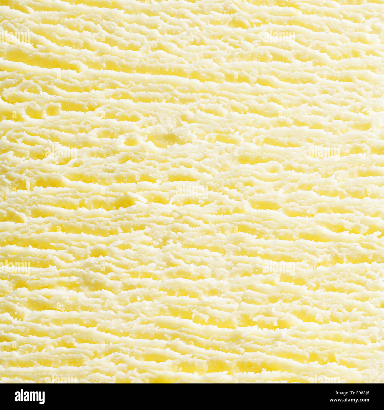 Macro abstract background of the surface texture of scoop of fresh creamy frozen vanilla icecream in square format. For ice-cream concept look at my portfolio Stock Photo