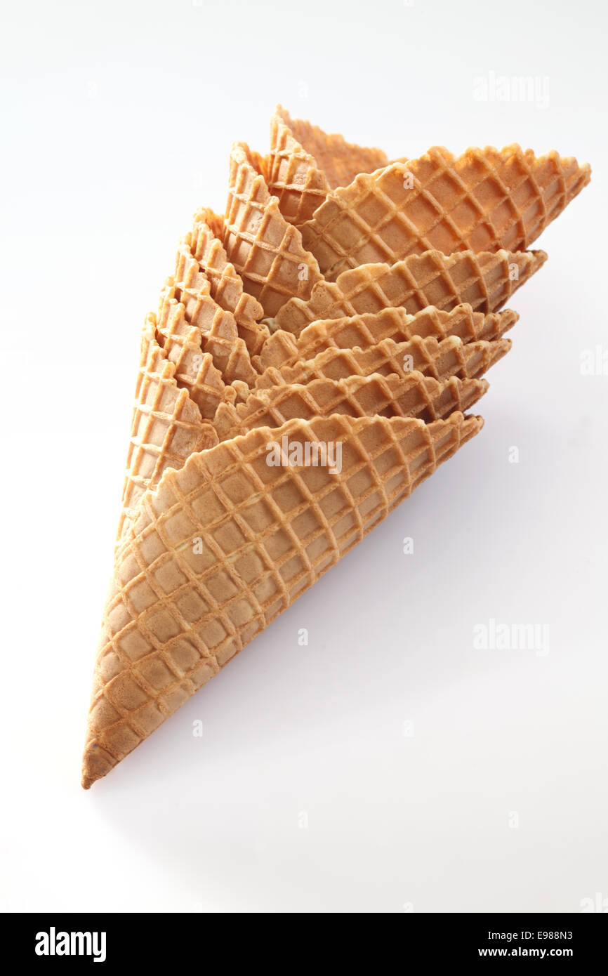 Stack of wide waffle pattern wafer ice-cream cones suitable for double scoop servings on white Stock Photo