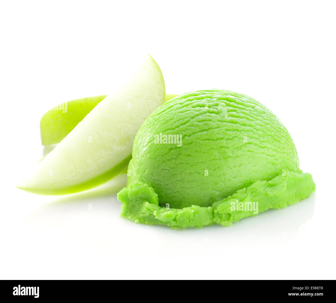 Green Scoop of Icecream with apple flavor and pieces of apple. Isolated on white background Stock Photo