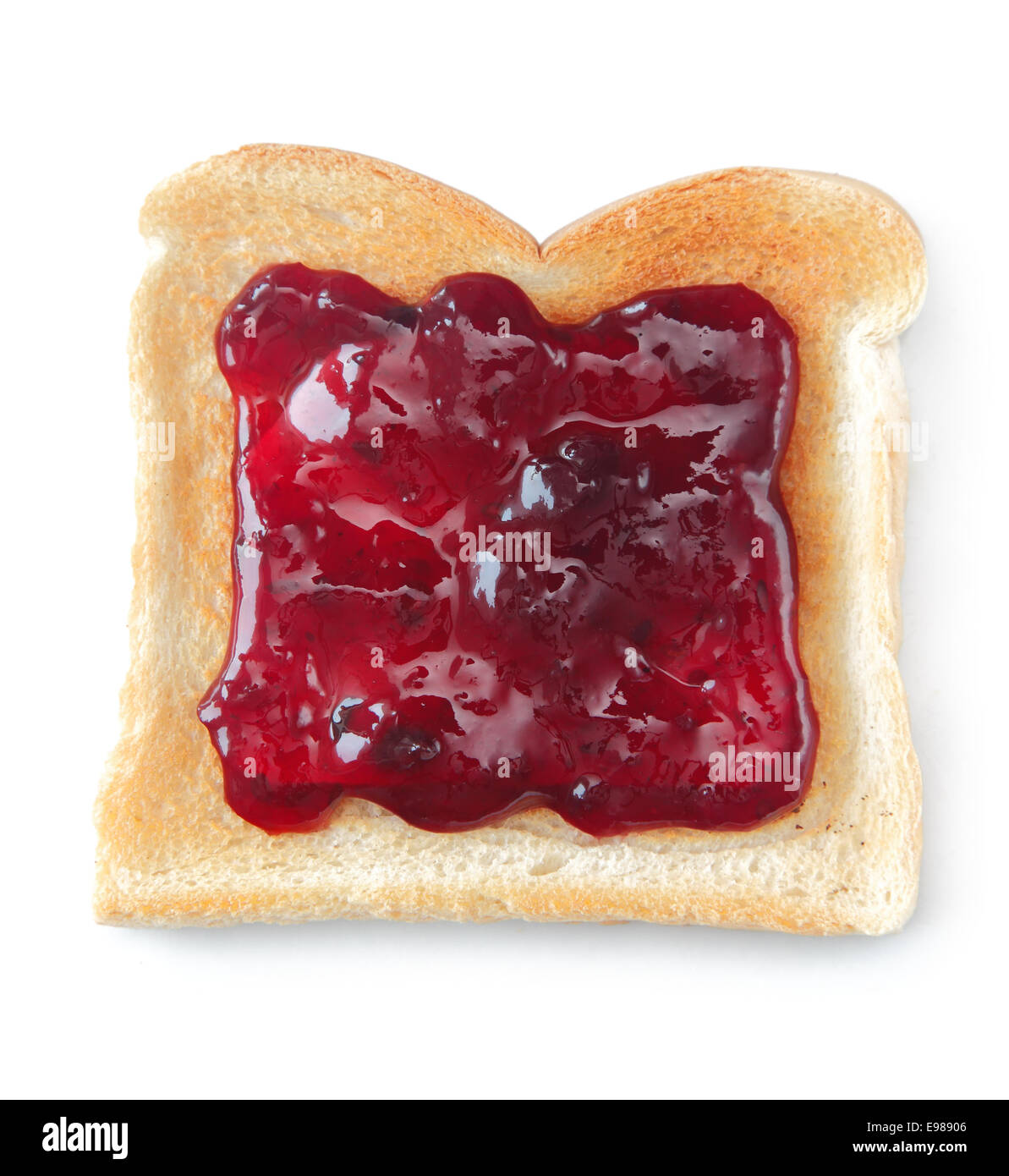 Slice of toast on a white background, made from white bread a liberally coated with a red berry jam Stock Photo