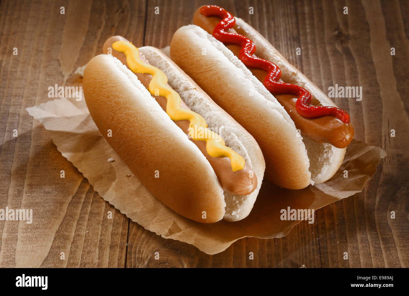 Two appetizing hotdogs with mustard and ketchup, close up Stock Photo