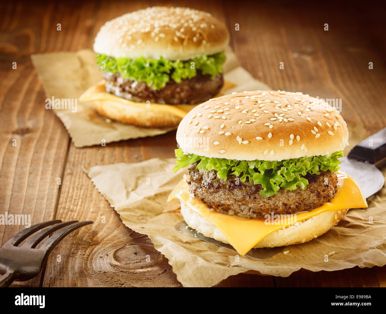 Two appetizing cheeseburger with meat, cheese and salad Stock Photo