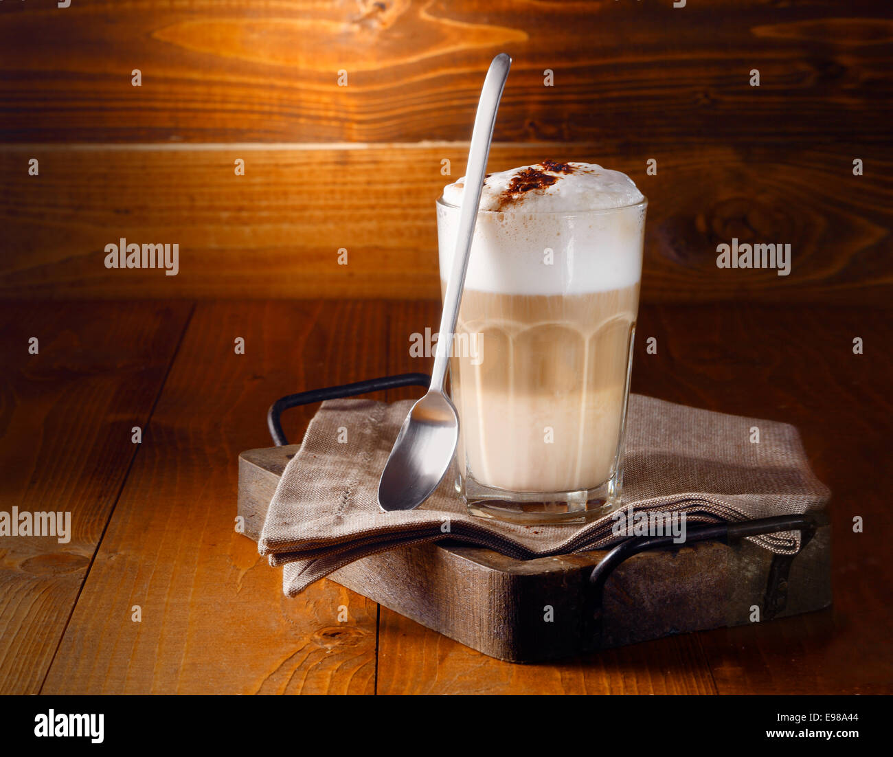 https://c8.alamy.com/comp/E98A44/delicious-layered-cappuccino-or-latte-macchiato-coffee-served-in-a-E98A44.jpg