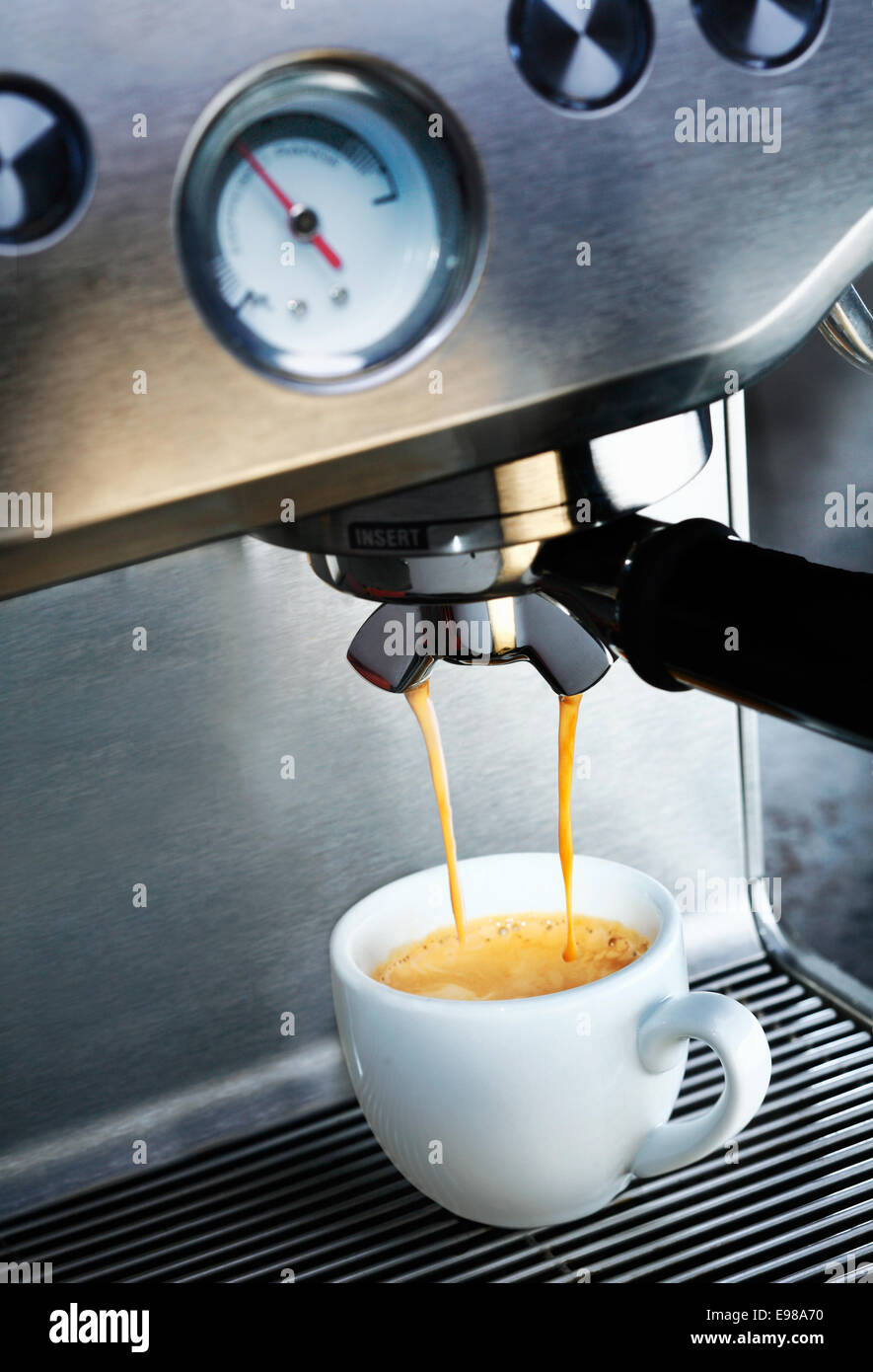 Purple cup on a espresso machine, blank space to the right for text Stock  Photo - Alamy