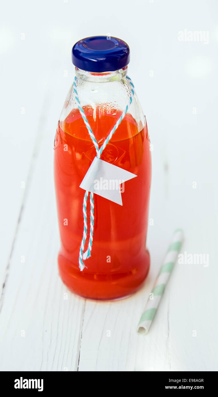 Close-up of a bottle of fresh tasty organic tomato juice with a blank label Stock Photo