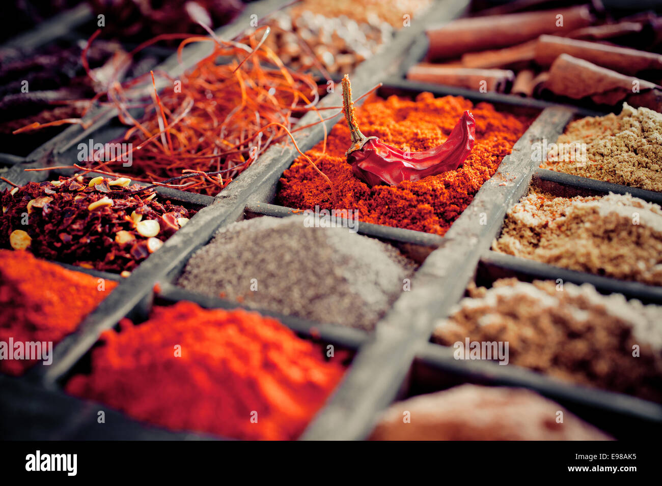 Close-up of different types of Assorted Spices in a wooden box. Stock Photo