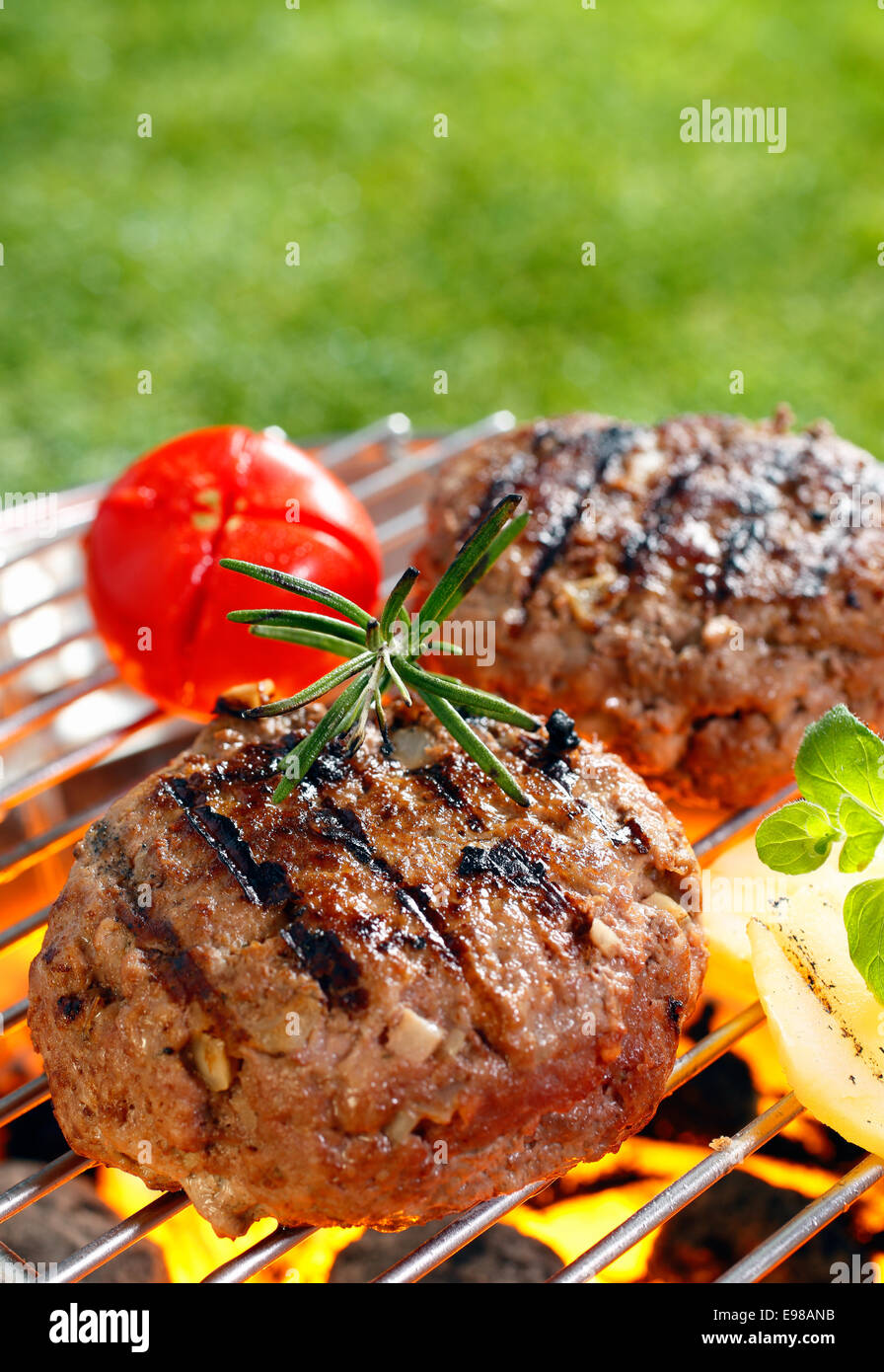 Brisket Burgers on the grilling pan with open flames Stock Photo Alamy
