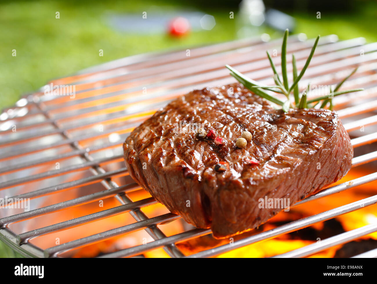 A thick strip steak being grilled outdoors Stock Photo - Alamy