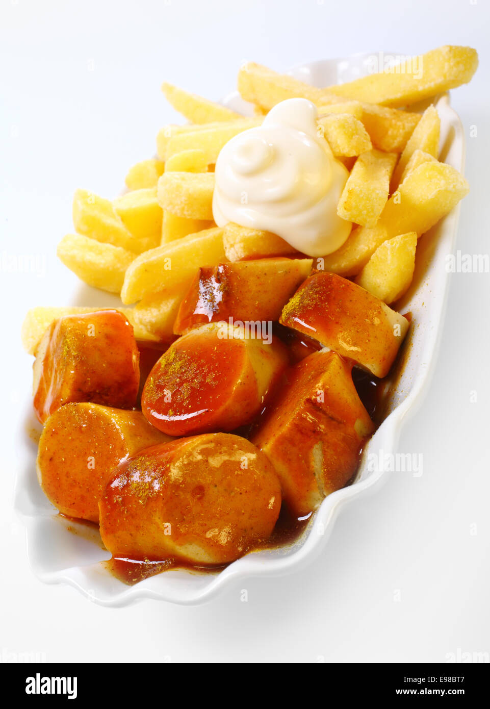 Crisp fried potato chips topped with creamy mayonnaise with sliced