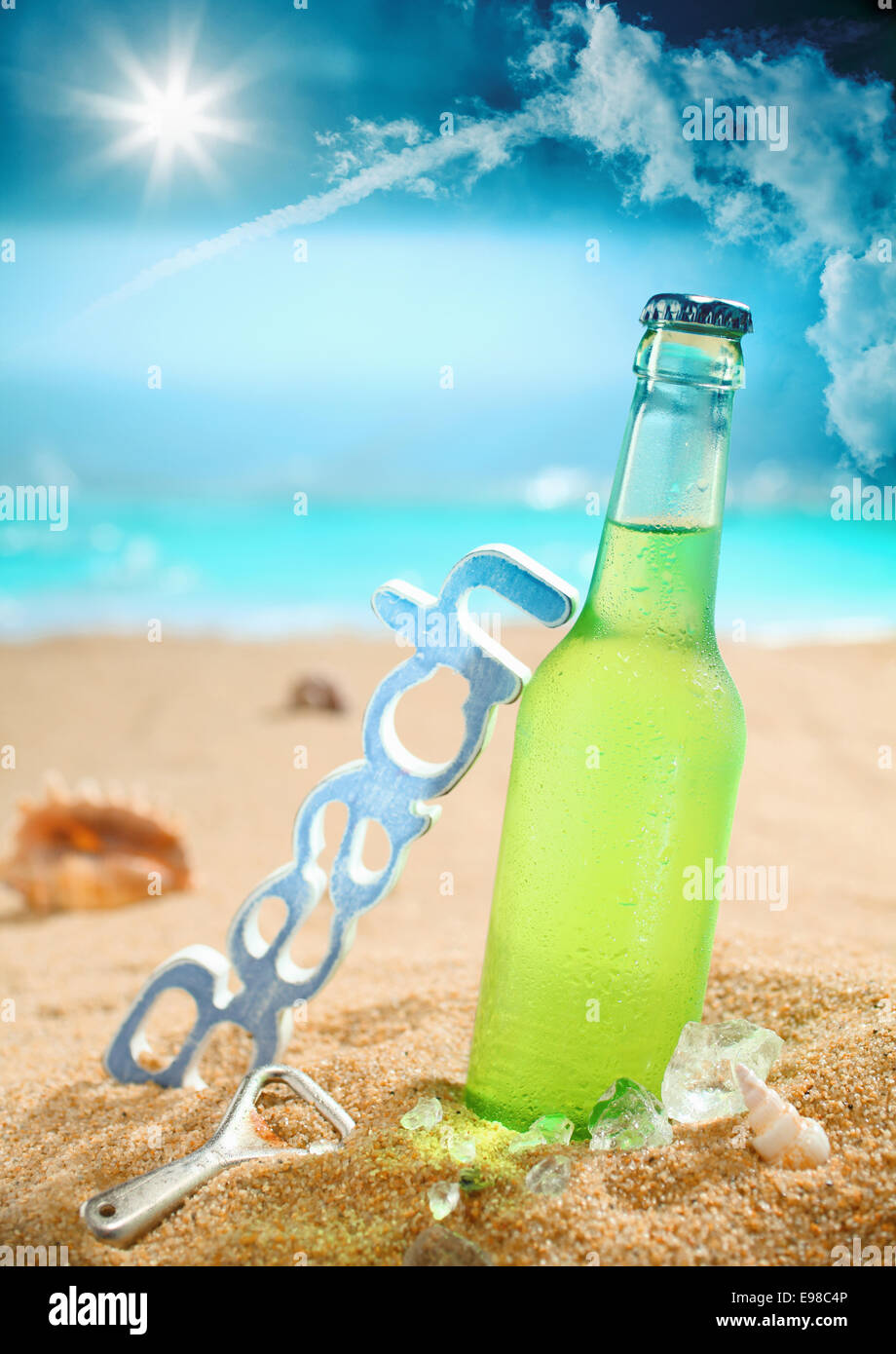 Beautiful composition of chilled beer, beach, bottle opener and amazing sky. Look at my portfolio for more cocktails. Stock Photo