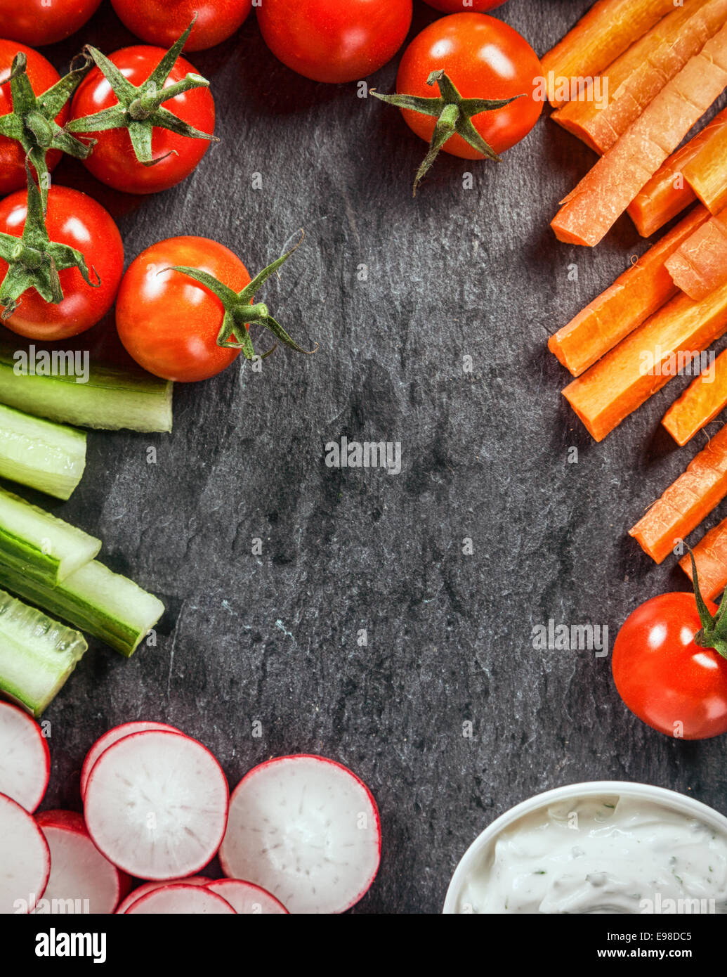 Frame of healthy vegetarian fresh vegetable crudites with sliced carrot