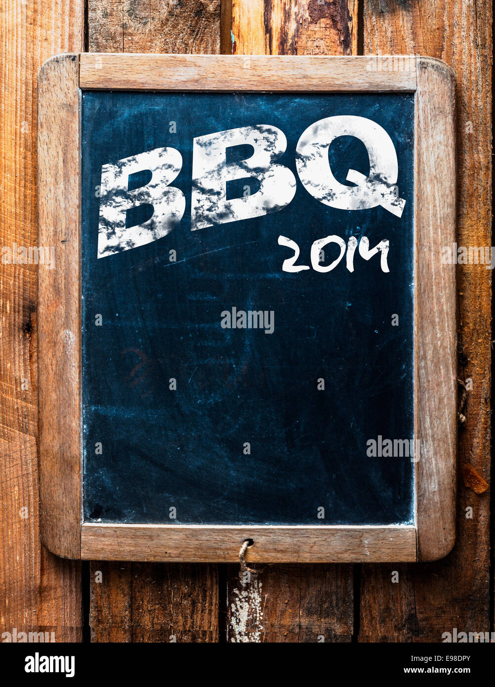 Old grunge BBQ advertising sign on an old school slate board with a distressed wooden frame and copyspace for your text mounted Stock Photo