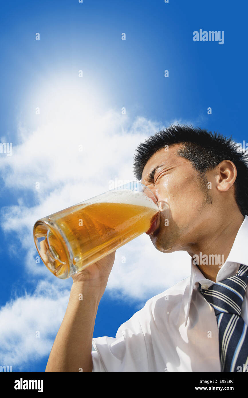 Japanese businessman drinking draft beer Stock Photo Alamy