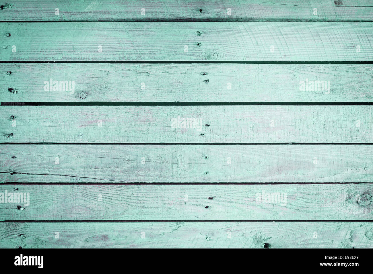 Aquamarine wooden background texture with faded parallel vintage wood planks with two haphazard rows of small nails in the 2014 Stock Photo