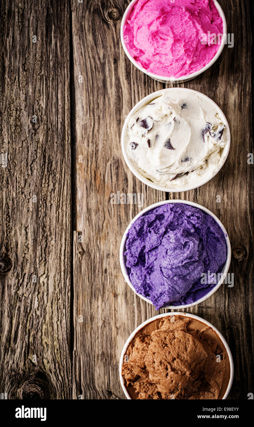 Colorful selection of Italian ice cream tubs viewed from above filled