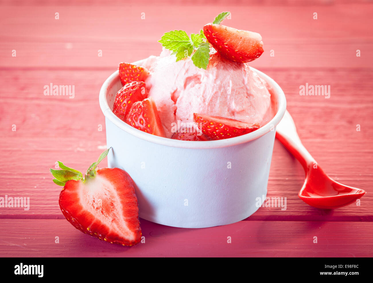 Cool refreshing strawberry ice cream or frozen yoghurt dessert served ...