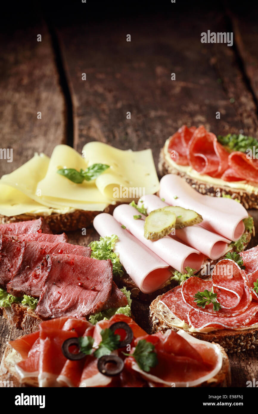 Assorted meat and cheese sandwiches with rare roast beef, mortadella