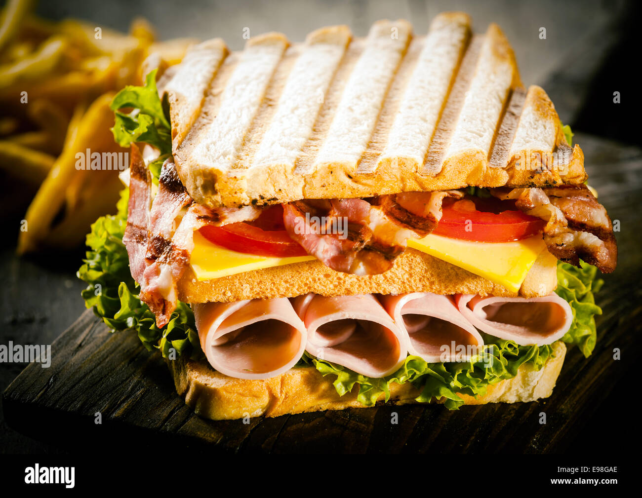 Delicious lunchtime snack of a toasted or grilled rolled ham and gouda
