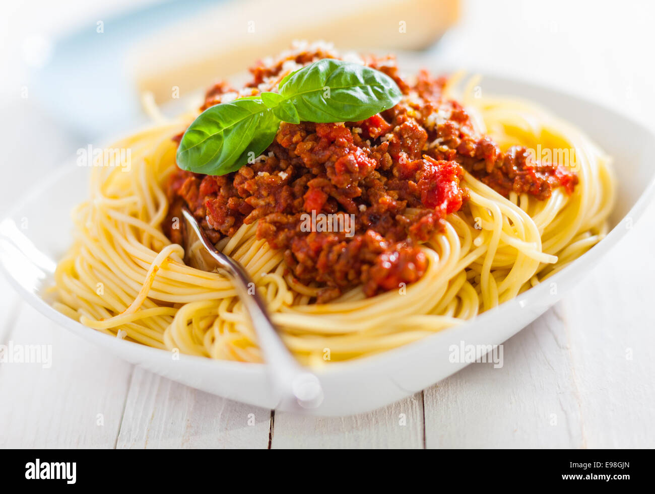 Bowl of delicious Italian spaghetti Bolognese topped with a rich meat