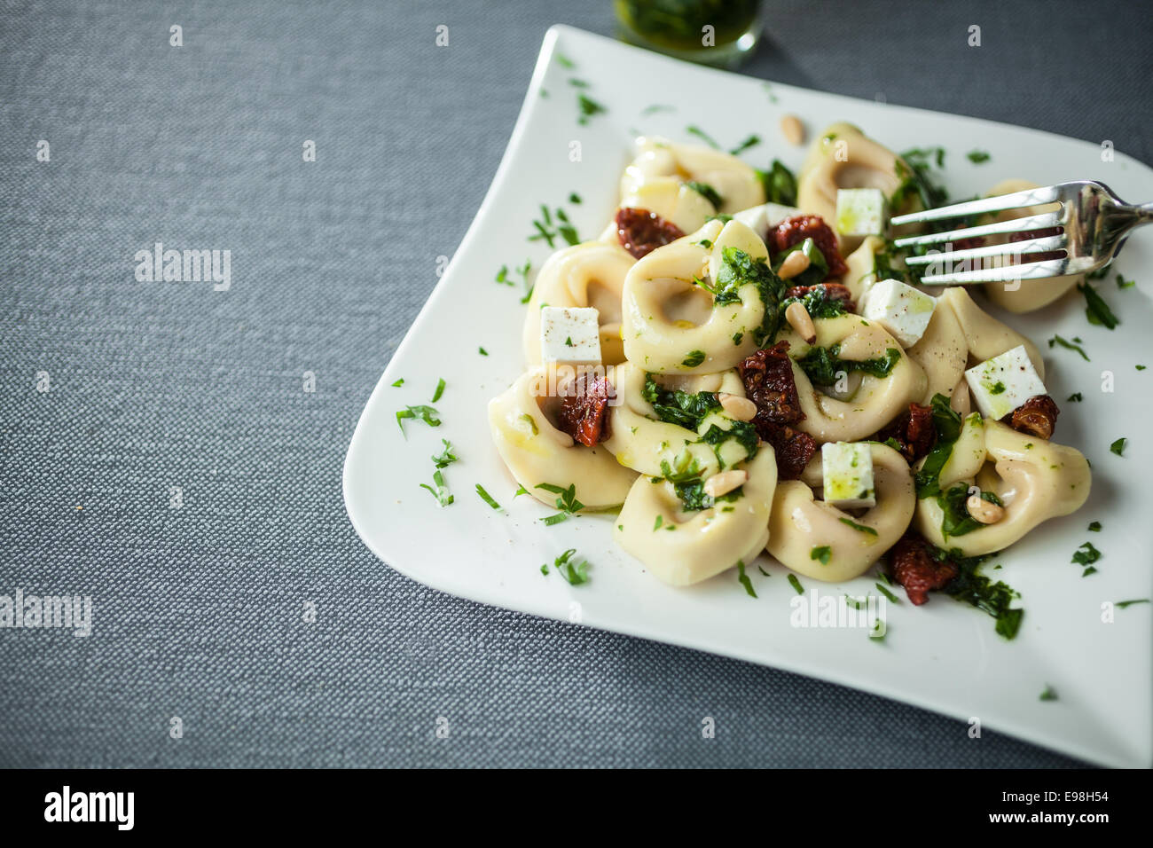 Serving of feta cheese, basil and pine nut pesto with Italian