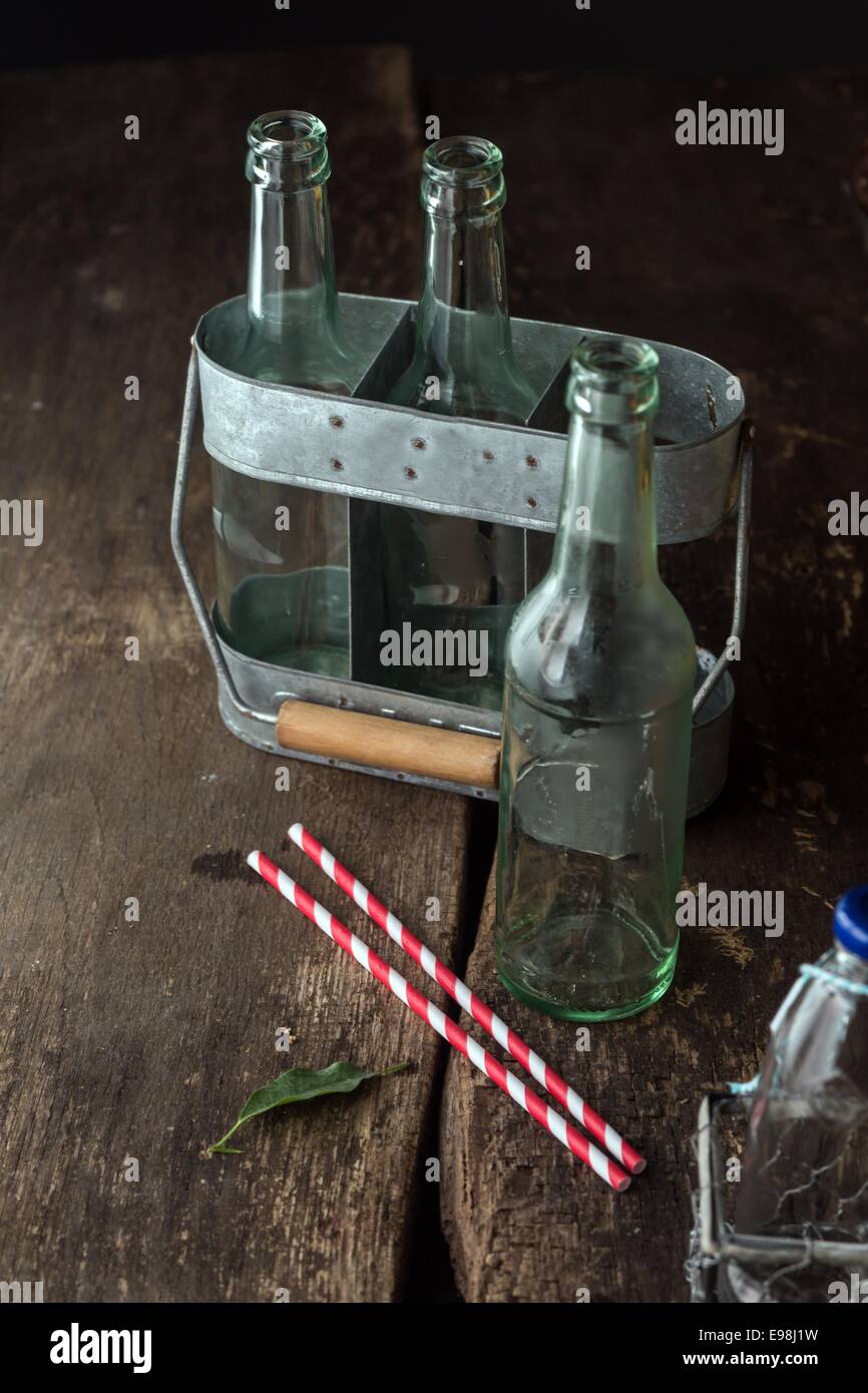 https://c8.alamy.com/comp/E98J1W/macro-shoot-empty-transparent-bottles-on-vintage-wooden-table-ready-E98J1W.jpg
