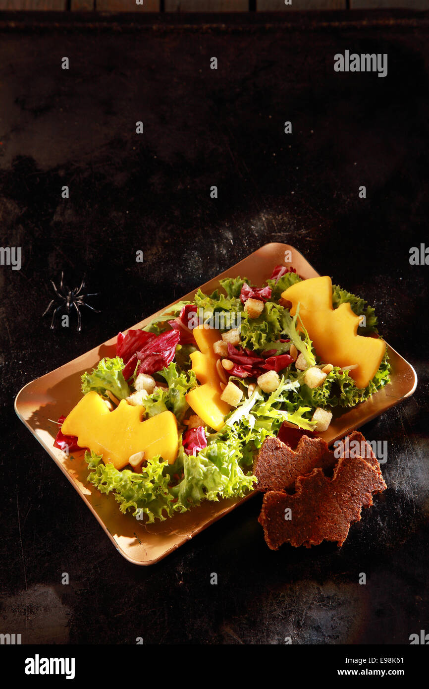 Bat Shaped Garnishes in Halloween Salad with Copyspace Stock Photo