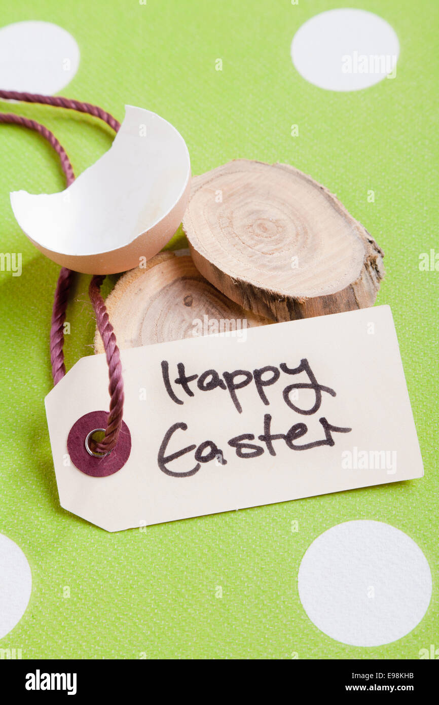 Easter image with broken egg shell and threade tag saying Happy Easter Stock Photo