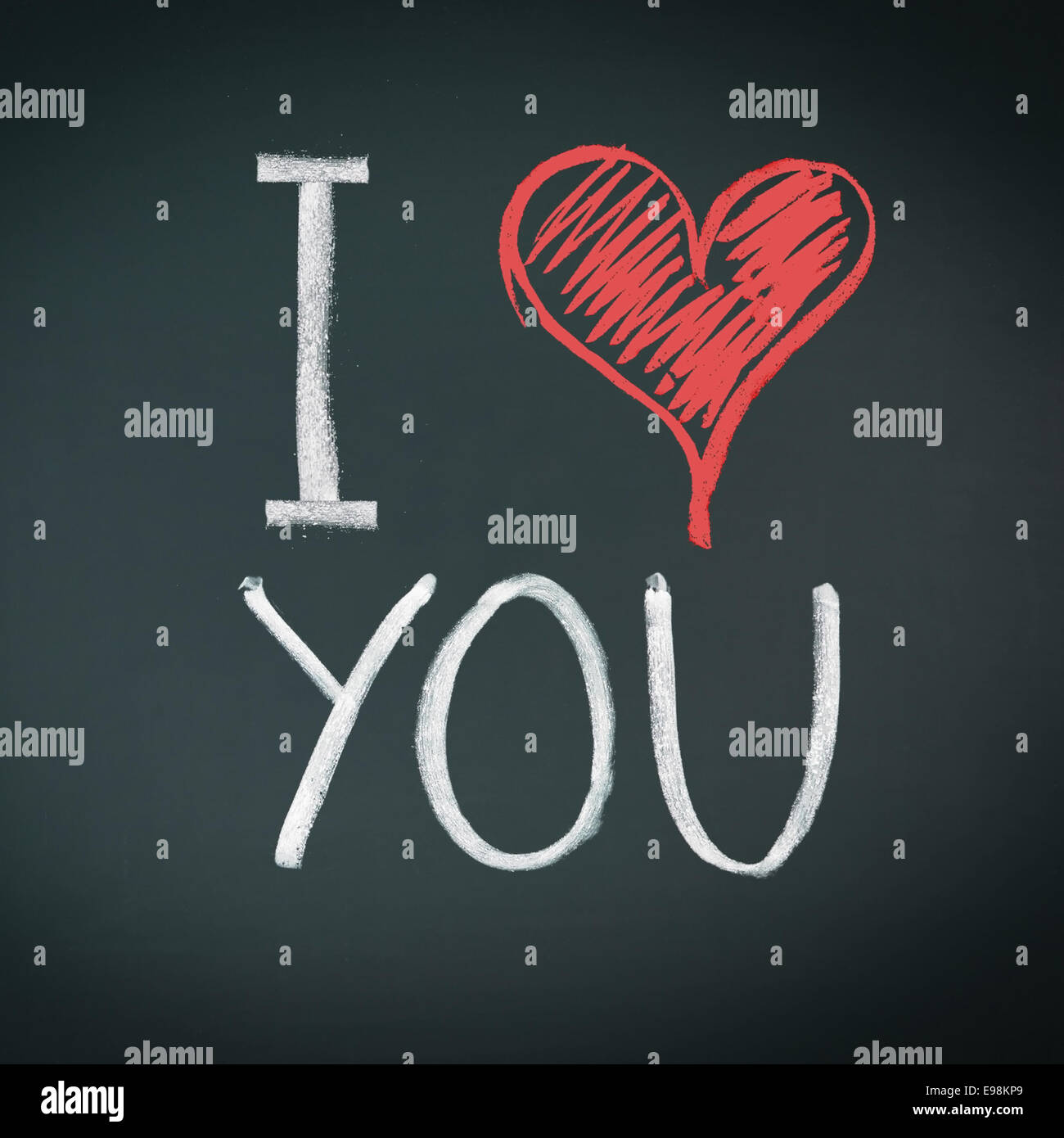 I Love You. Handwritten message on a chalkboard with an illustrated heart used as a symbol of love in this Valentines message. Stock Photo