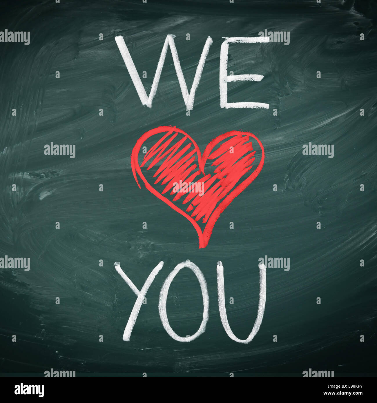 We Love You. Handwriiten message in chalk on a blackboard ...