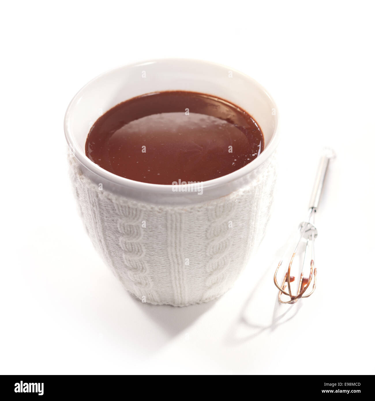 White ceramic cup filled with thick delicious melted chocolate that has been whisked Stock Photo